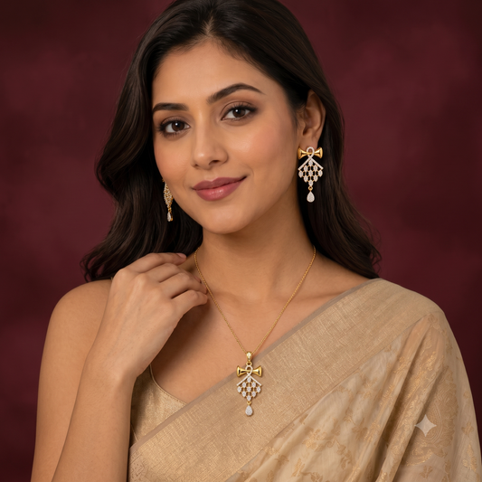 Indian model wearing a beautiful gold-tone American Diamond bow necklace and earrings set with a saree.