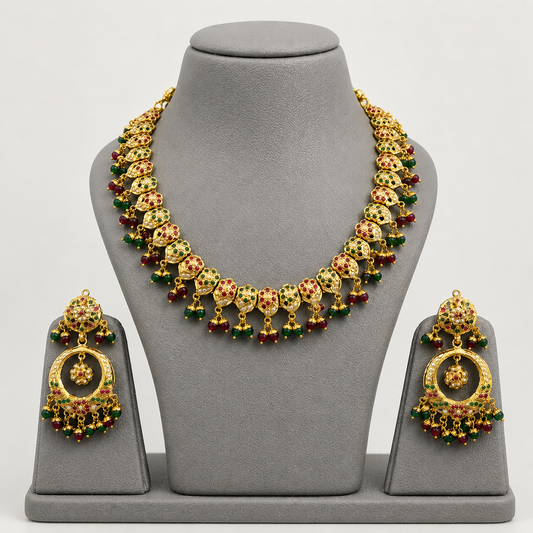 Traditional Jadau Necklace Set with Red & Green Stones and Pearl Embellishments