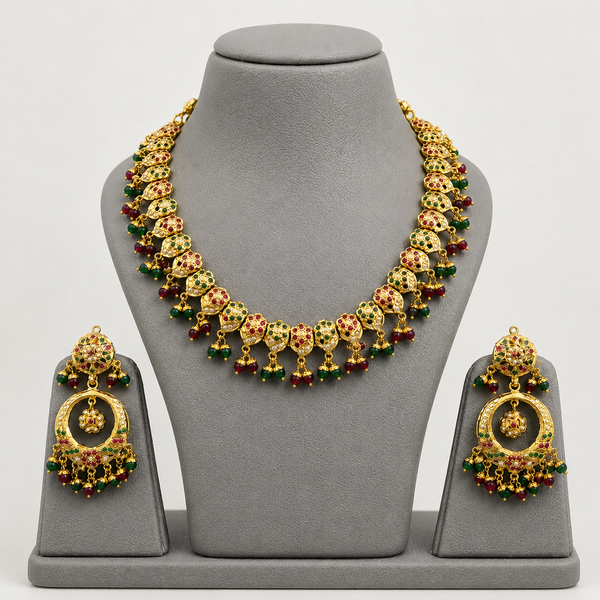 Traditional Jadau Necklace Set with Red & Green Stones and Pearl Embellishments