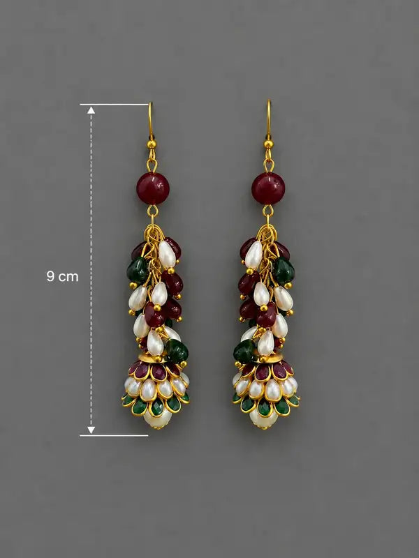 Handcrafted earrings blend of pearls rubies and emeralds,. intricate resin work on jhumki Perfect for adding a sophisticated, traditional flair to any ensemble.