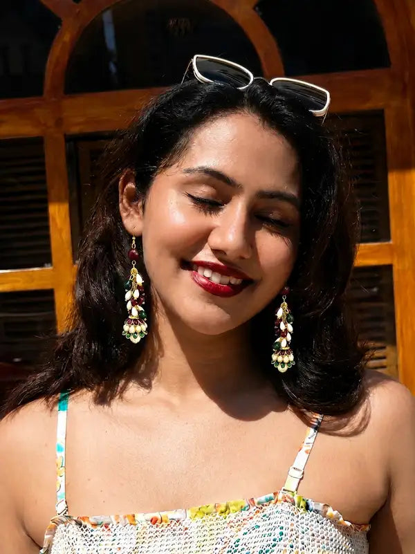 Handcrafted earrings blend of pearls rubies and emeralds,. intricate resin work on jhumki Perfect for adding a sophisticated, traditional flair to any ensemble.