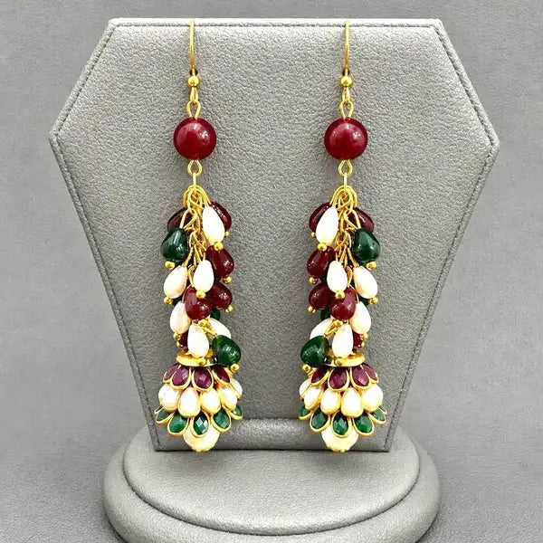 Handcrafted earrings blend of pearls rubies and emeralds,. intricate resin work on jhumki Perfect for adding a sophisticated, traditional flair to any ensemble.