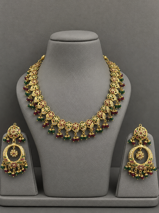 Traditional Jadau Necklace Set with Red & Green Stones and Pearl Embellishments