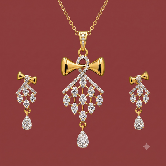 Gold-tone American Diamond bow pendant set with matching drop earrings on a dark red background.