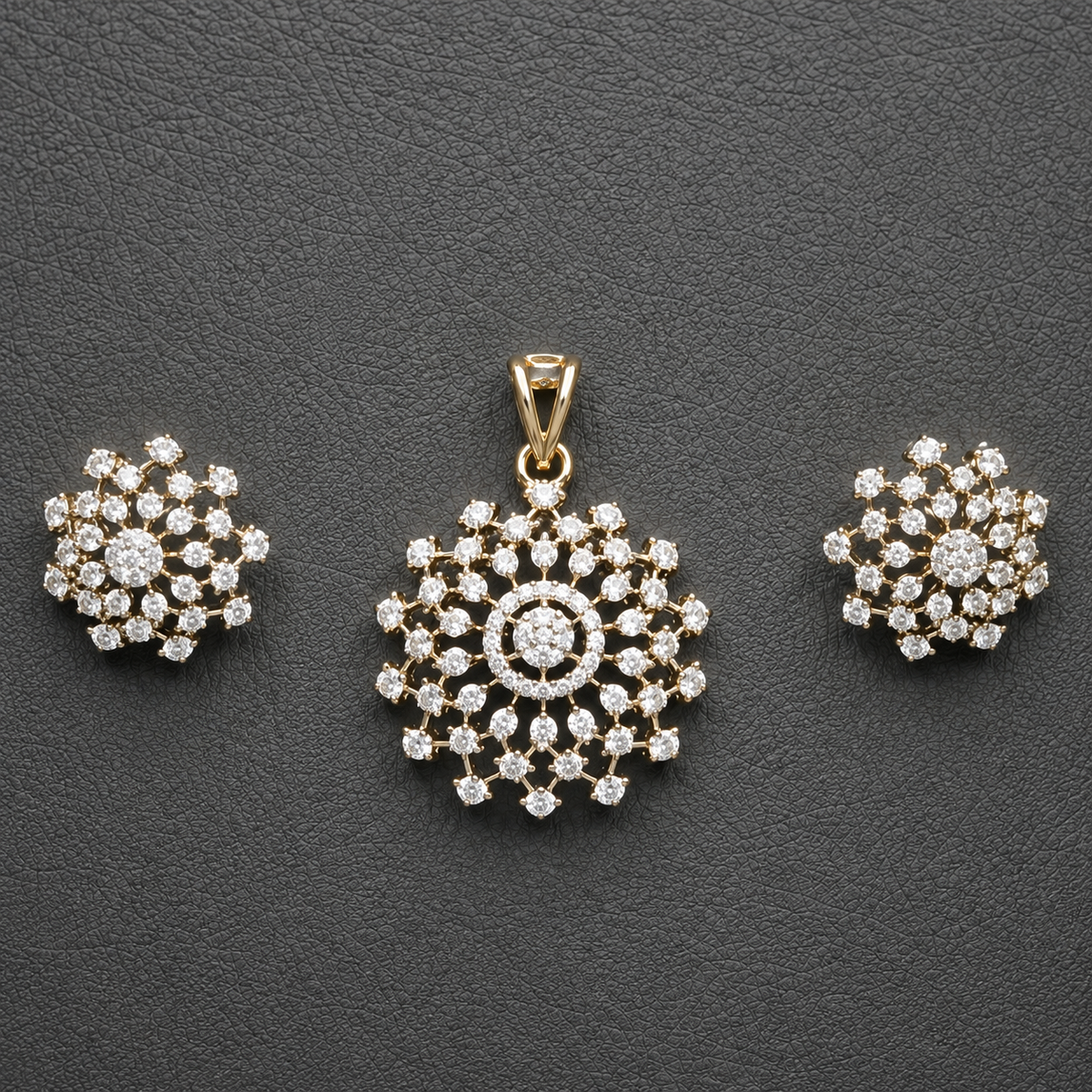 Gold-tone American Diamond floral pendant and matching stud earring set, beautifully displayed against a rich maroon background.