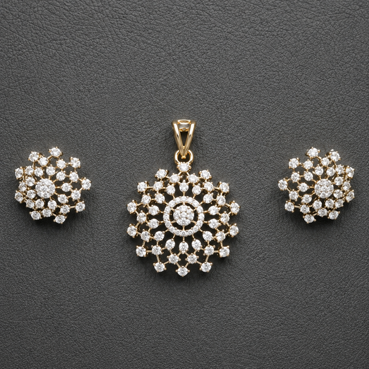 Gold-tone American Diamond floral pendant and matching stud earring set, beautifully displayed against a rich maroon background.