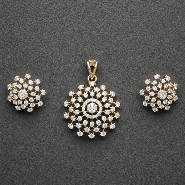 Gold-tone American Diamond floral pendant and matching stud earring set, beautifully displayed against a rich maroon background.