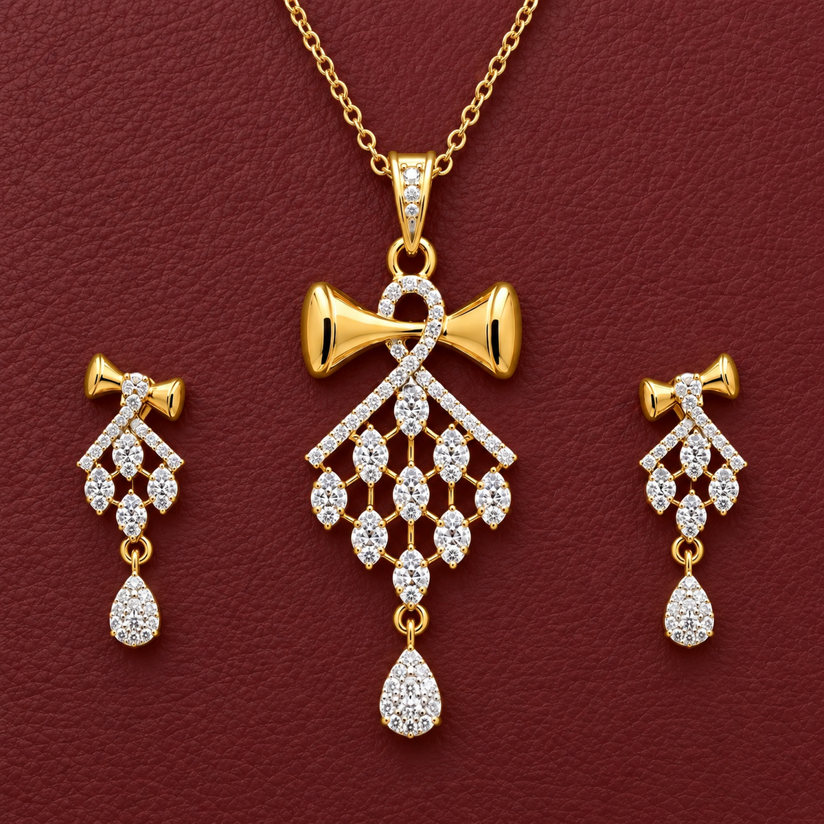 Antique gold-tone necklace and earrings set featuring royal crimson gemstones and pearls on a textured crimson velvet background.